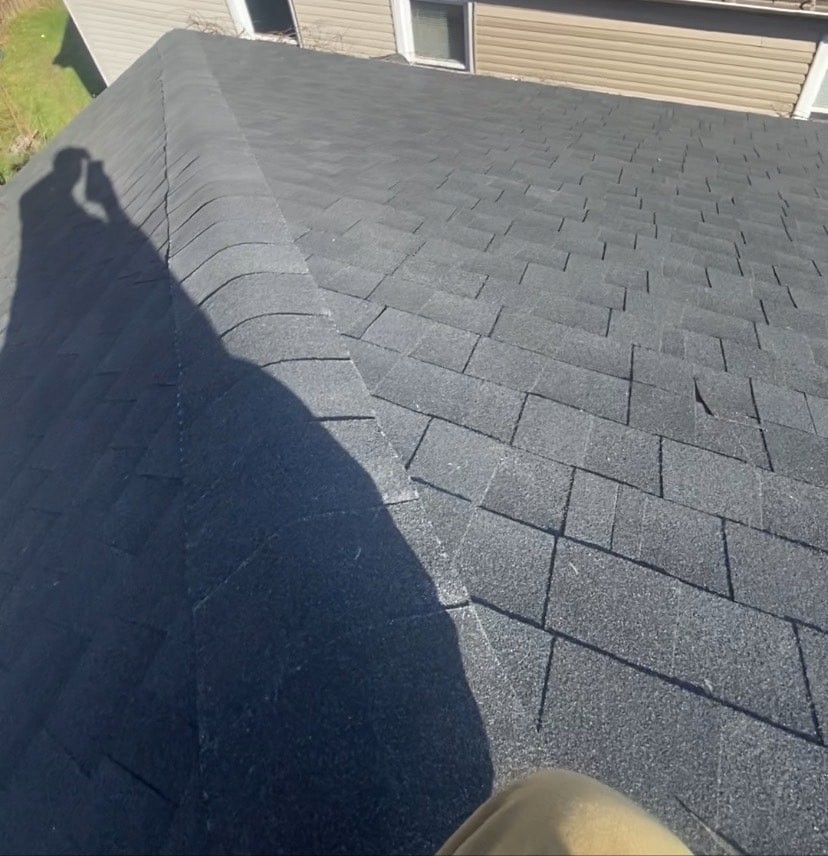 Completed residential roof replacement with new dark gray asphalt shingles installed by Set2 Go